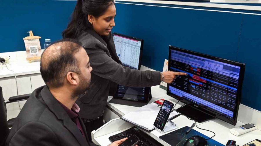 Bikaner, Dec 31 (ANI): Stock market brokers monitor markets as they close with over 10% gains compared to last year, in Bikaner on Wednesday. (ANI Photo)