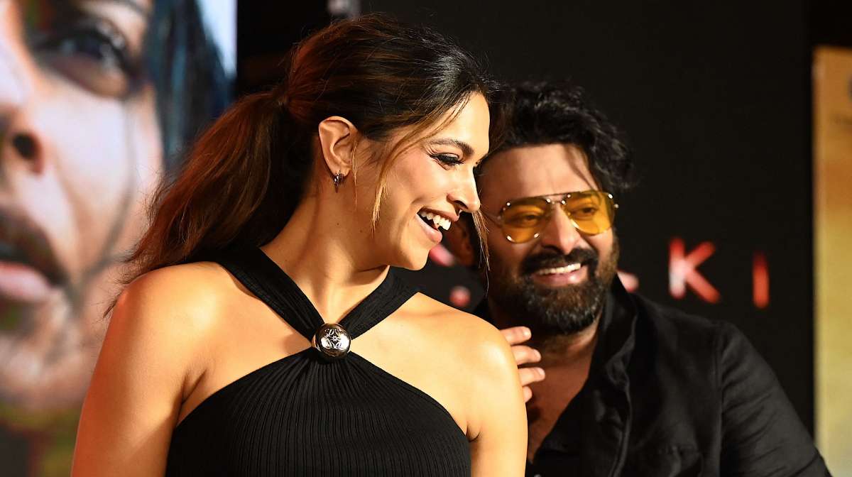 Actors Deepika Padukone (L) and Prabhas attend a promotional event of their upcoming Indian epic science fiction dystopian film  Kalki 2898 AD  in Mumbai on June 19, 2024. (Photo by Sujit JAISWAL / AFP)