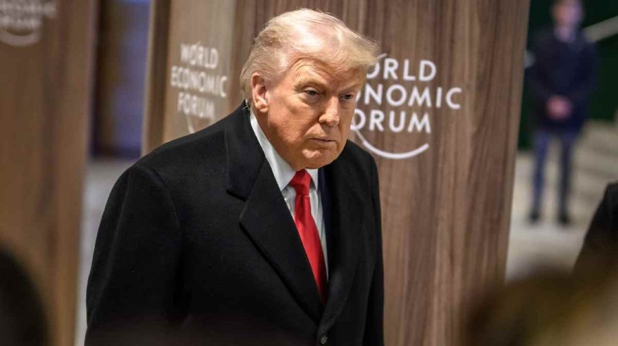 US President Donald Trump addresses the media as he leaves the congress centre during the World Economic Forum (WEF) annual meeting in Davos on January 21, 2026. The World Economic Forum takes place in Davos from January 19 to January 23, 2026. (Photo by Fabrice COFFRINI / AFP)