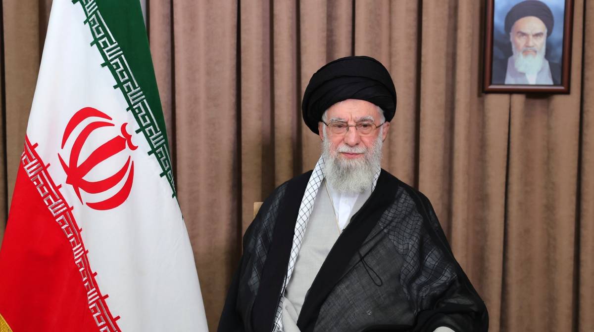 This photo released by an official website of the office of the Iranian supreme leader, shows Supreme Leader Ayatollah Ali Khamenei in a televised speech, under a portrait of the late revolutionary founder Ayatollah Khomeini, Friday, June 13, 2025. (Office of the Iranian Supreme Leader via AP)