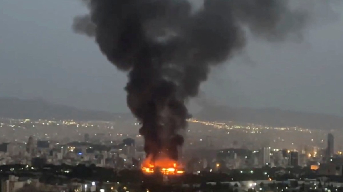 Smoke rises from a fire, as the Israel-Iran air war continues, in Tehran, Iran, in this still image obtained from social media video released June 17, 2025.  Social Media/via REUTERS  THIS IMAGE HAS BEEN SUPPLIED BY A THIRD PARTY. NO RESALES. NO ARCHIVES. NEWS USE ONLY