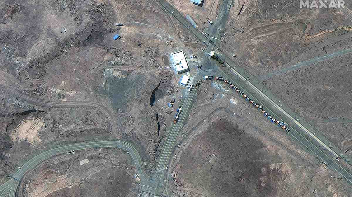 This handout satellite picture provided by Maxar Technologies and taken on June 19, 2025, shows trucks positioned near the entrance of Iran's Fordow Fuel Enrichment Plant (FFEP), northeast of the city of Qom. President Donald Trump said US air strikes early on June 22 "totally obliterated" Iran's main nuclear sites, as Washington joined Israel's war with Tehran in a flashpoint moment for the Middle East. (Photo by Satellite image ©2025 Maxar Technologies / AFP) / RESTRICTED TO EDITORIAL USE - MANDATORY CREDIT "AFP PHOTO/ SATELLITE IMAGE ©2025 MAXAR TECHNOLOGIES" - NO MARKETING NO ADVERTISING CAMPAIGNS - DISTRIBUTED AS A SERVICE TO CLIENTS - THE WATERMARK MAY NOT BE REMOVED/CROPPED