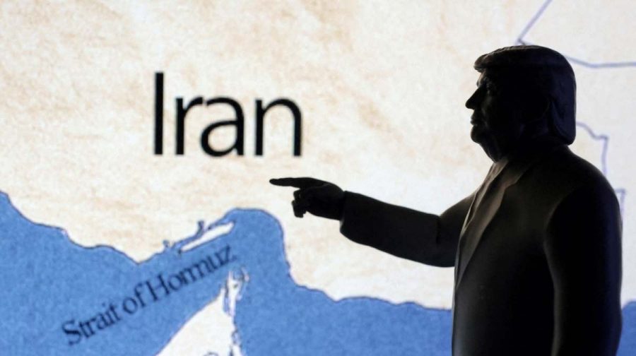 A map showing the Strait of Hormuz and Iran is seen behind a 3D printed miniature of U.S. President Donald Trump in this illustration taken June 22, 2025. REUTERS/Dado Ruvic/Illustration