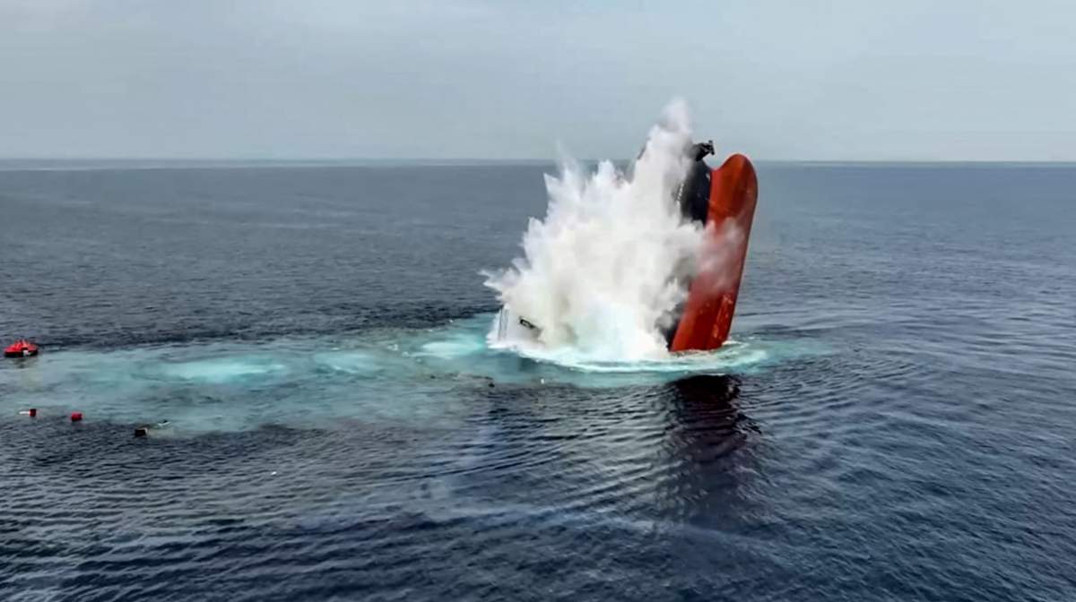 TOPSHOT - This handout picture released by Yemen's Huthi Ansarullah Media Centre on July 8, 2025 reportedly shows the Liberia-flagged bulk carrier Eternity sinking C after it was attacked by the Huthis at sea. The Huthis claimed responsibility on July 9 for the deadly attack that sank the merchant vessel earlier this week, their second attack on Red Sea shipping in 24 hours as they resumed their campaign in the key waterway. The ship was badly damaged in the attack that started on July 7 and continued into the following day before the ship sank. (Photo by ANSARULLAH MEDIA CENTRE / AFP) / === RESTRICTED TO EDITORIAL USE - MANDATORY CREDIT "AFP PHOTO / HO / Ansarullah Media Centre" - NO MARKETING - NO ADVERTISING CAMPAIGNS - DISTRIBUTED AS A SERVICE TO CLIENTS ===