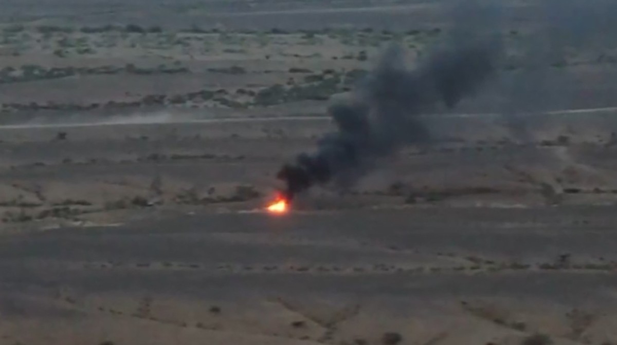 This screen grab taken from video footage released by Ansarullah Media Centre on October 10, 2026 shows what they say is fire burning in the distance following a drone strike against Saudi-backed Yemeni government forces. The Iranian-backed Houthis, at war against the internationally-recognised government, launched a lightning offensive in September 2026, that has killed hundreds of combatants on both sides and, according to UN figures, forced more than 145,000 people to flee their homes. (Photo by ANSARULLAH MEDIA CENTRE / AFP) / RESTRICTED TO EDITORIAL USE - MANDATORY CREDIT "AFP PHOTO / ANSARULLAH MEDIA CENTRE" - HANDOUT - NO MARKETING NO ADVERTISING CAMPAIGNS - DISTRIBUTED AS A SERVICE TO CLIENTS