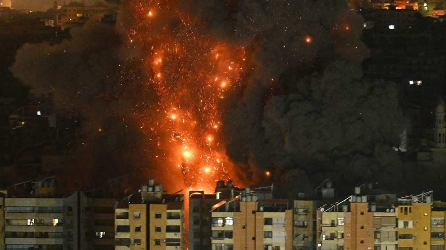 A fireball rises from the site of an Israeli airstrike that targeted an area in Beiruts southern suburbs overnight March 10 to 11, 2026.