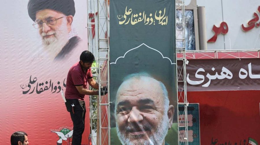 FILE PHOTO: A man installs a banner with a picture of late Islamic Revolutionary Guard Corps (IRGC) Commander-in-Chief Major General Hossein Salami, following the Israeli strikes on Iran, in Tehran, June 14, 2025. Majid Asgaripour/WANA (West Asia News Agency) via REUTERS   ATTENTION EDITORS - THIS PICTURE WAS PROVIDED BY A THIRD PARTY/File Photo