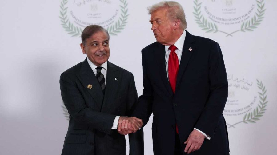 U.S. President Donald Trump and Pakistani Prime Minister Shehbaz Sharif shake hands as they pose for a photo, at a world leaders' summit on ending the Gaza war, amid a U.S.-brokered prisoner-hostage swap and ceasefire deal between Israel and Hamas, in Sharm el-Sheikh, Egypt, October 13, 2025. REUTERS/Suzanne Plunkett/Pool