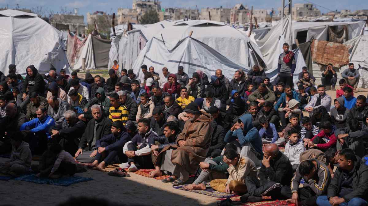 Muslim worshippers take part in the Friday prayers during the holy month of Ramadan outside the destroyed Al-Albani Mosque, in Khan Younis, southern Gaza Strip, Friday, Feb. 27, 2026. (AP Photo/Abdel Kareem Hana)
