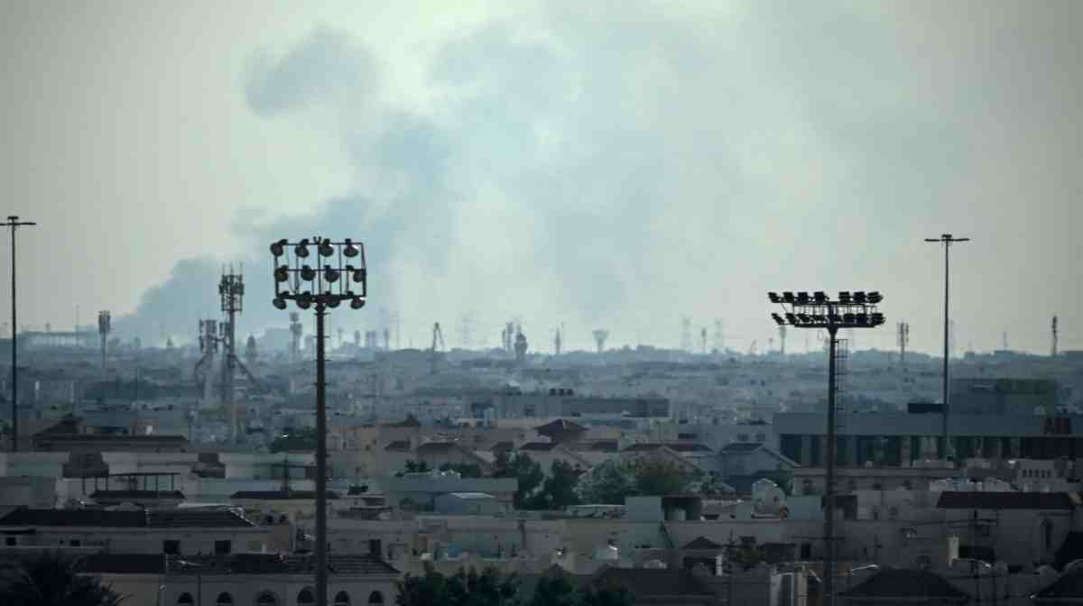 Smoke rises from an area in the direction of Al Udeid Air Base, which houses the Qatar Emiri Air Force and foreign forces including the US, in Doha on February 28, 2026, following a reported Iranian strike. The United States and Israel launched strikes against Iran on February 28, with Israel's public broadcaster reporting that supreme leader Ayatollah Ali Khamenei had been targeted, as the Islamic republic retaliated with barrages of missiles at Gulf states and Israel. (Photo by MAHMUD HAMS / AFP)