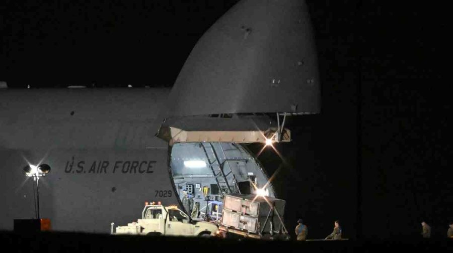 Members of the US military offload equipment from a US Air Force C-5 Galaxy at RAF Fairford in south west England on March 6, 2026. Britain's Prime Minister Keir Starmer has given approval for Washington to use the bases of Diego Garcia in the Indian Ocean and RAF Fairford in southwest England to bomb Iranian missile sites, after several Gulf countries were targeted by Iranian retaliations. (Photo by JUSTIN TALLIS / AFP)
