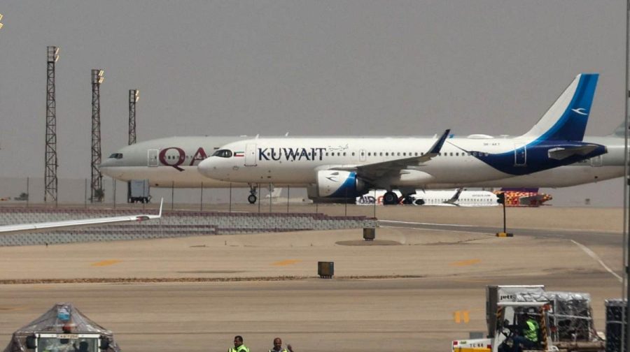 Planes of Kuwait Airways and Qatar Airways are seen through the window of a Middle East Airlines aircraft at Cairo International Airport, amid the U.S.-Israeli conflict with Iran, in Cairo, Egypt, March 31, 2026. REUTERS/Amr Abdallah Dalsh