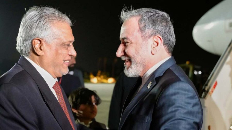 In this photo provided by the Iranian Foreign Ministry, Iranian Foreign Minister Abbas Araghchi, right, is welcomed by Pakistani Foreign Minister Ishaq Dar upon his arrival at Nur Khan airbase in Rawalpindi, Pakistan, Friday, April 24, 2026. (Iranian Foreign Ministry via AP)