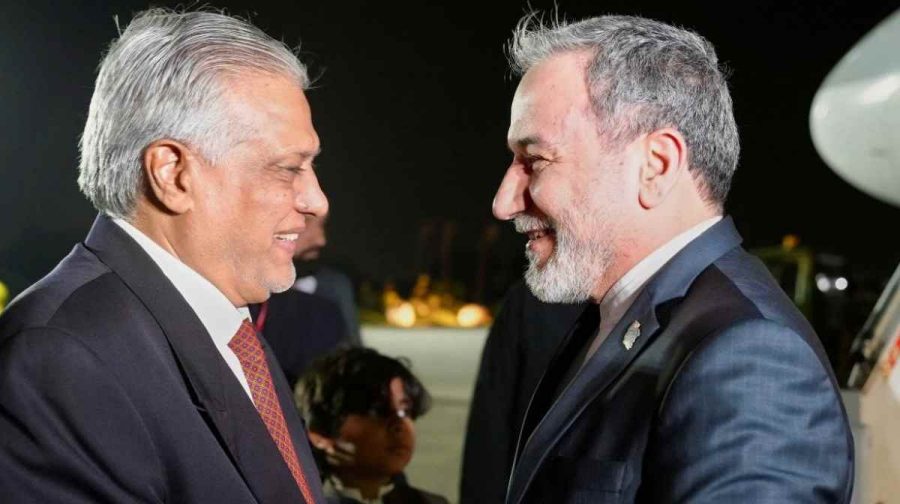 In this photo provided by the Iranian Foreign Ministry, Iranian Foreign Minister Abbas Araghchi, right, is welcomed by Pakistani Foreign Minister Ishaq Dar upon his arrival at Nur Khan airbase in Rawalpindi, Pakistan, Friday, April 24, 2026. (Iranian Foreign Ministry via AP)