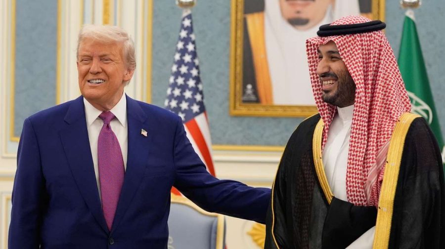 President Donald Trump and Saudi Crown Prince Mohammed bin Salman gesture as they meet delegations at the Royal Palace in Riyadh, Saudi Arabia, Tuesday, May 13, 2025. (AP Photo/Alex Brandon)