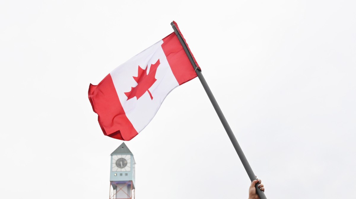 U.S. Open tennis champion Bianca Andreescu waves a Canadian flag at the "She The North" celebration rally in her honour in Mississauga, Ontario, Canada September 15, 2019. REUTERS/Moe Doiron