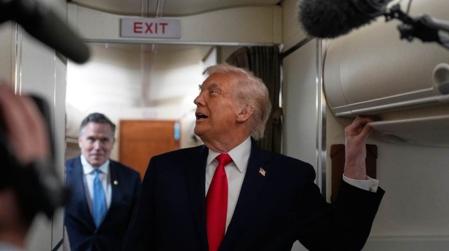 President Donald Trump speaks with reporters while in flight on Air Force One from Joint Base Andrews to Avoca, Pa., Tuesday, Dec. 9, 2025. (AP Photo/Alex Brandon)