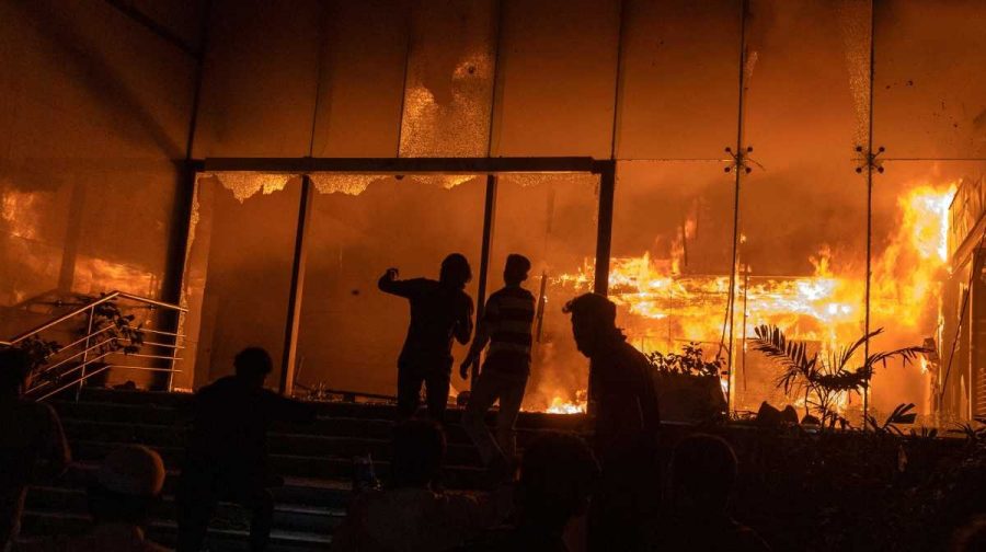 A group of people set fire to The Daily Star newspaper office building following the death of Sharif Osman Hadi, a student leader who had been receiving treatment in Singapore after being shot in the head, in Dhaka, Bangladesh, December 19, 2025. REUTERS/Abdul Goni 
