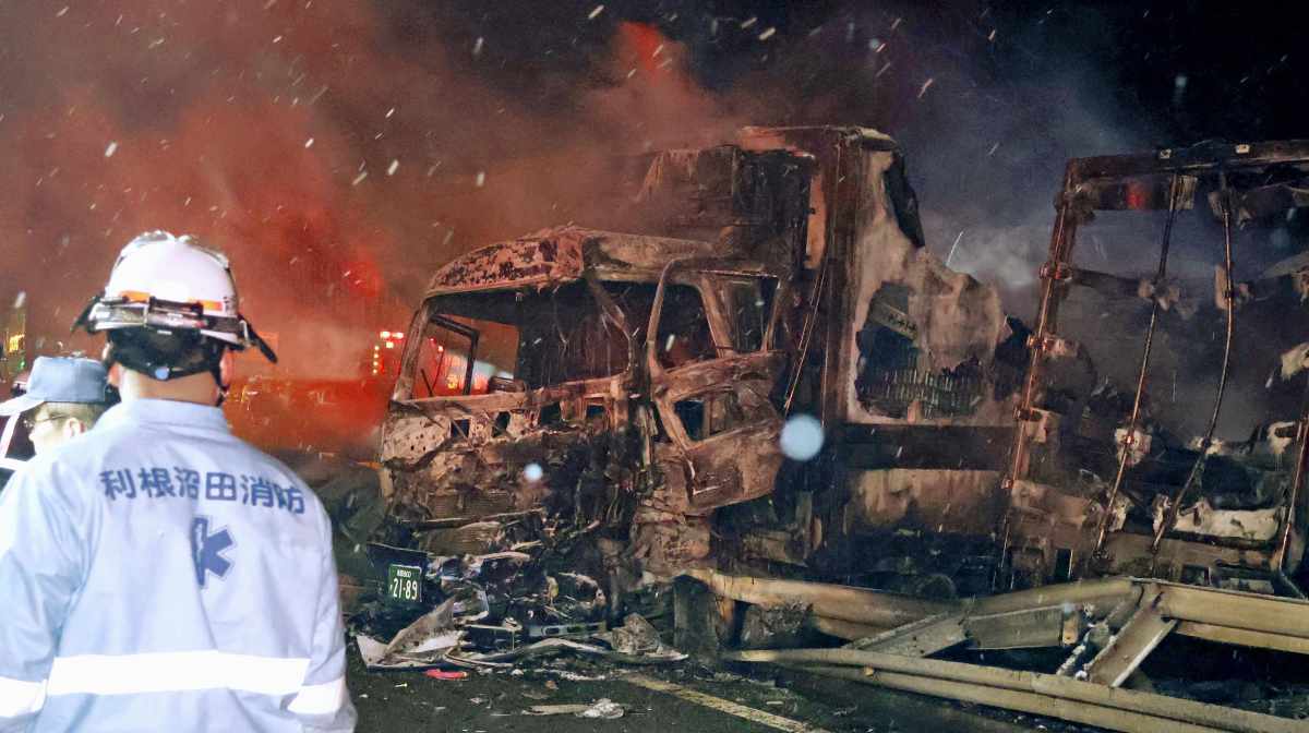 Burnt vehicles are seen after a massive crash in snowy weather on an expressway, in Minakami, northwest of Tokyo, early Saturday, Dec. 27, 2025. (Kyodo News via AP)