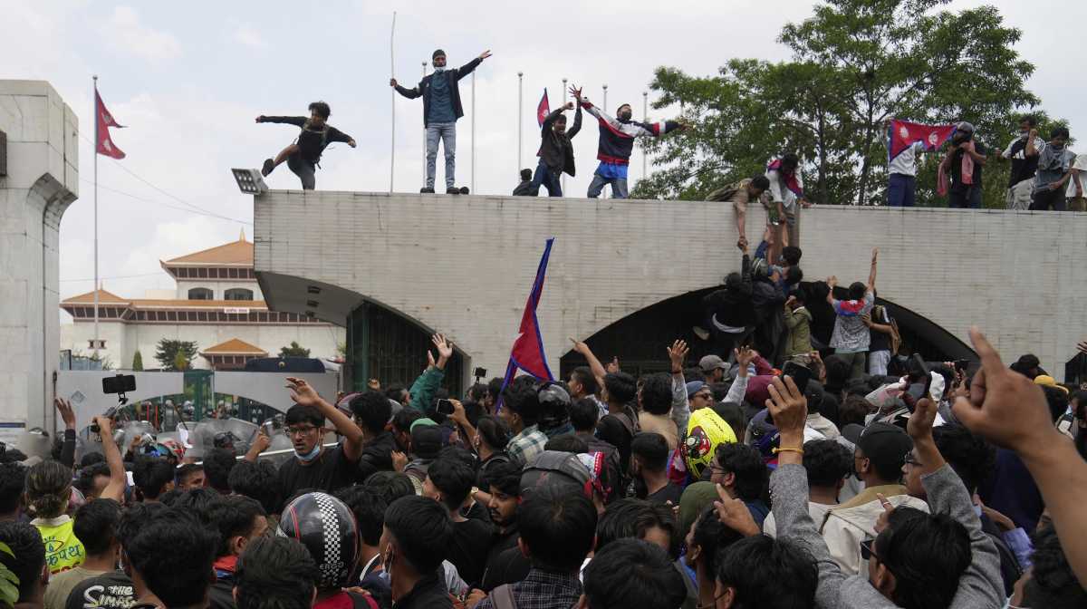 Protesters shout slogans as they gather outside the Parliament building in Kathmandu, Nepal, Monday, Sept. 8, 2025. AP/PTI