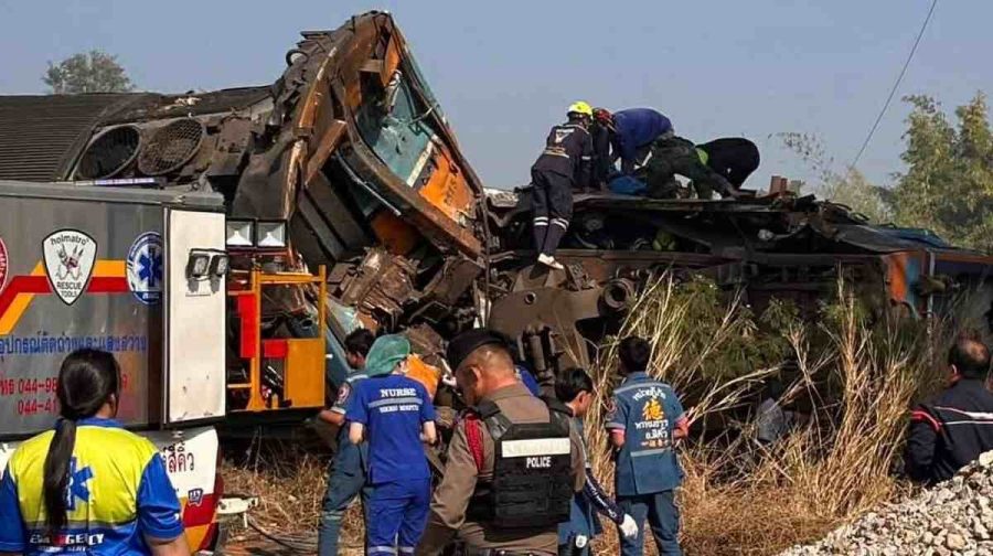 This photo released from State Railway of Thailand, shows aid workers after a construction crane fell into a passenger train in Nakhon Ratchasima province, Thailand Wednesday, Jan. 14, 2026. (State Railway of Thailand via AP)