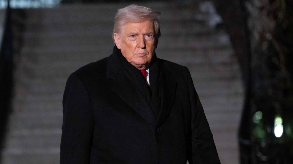 US President Donald Trump walks to board Marine One at the White House in Washington, DC, on January 20, 2026. Trump is heading to the Swiss ski resort of Davos to attend the World Economic Forum (WEF). (Photo by SAUL LOEB / AFP)