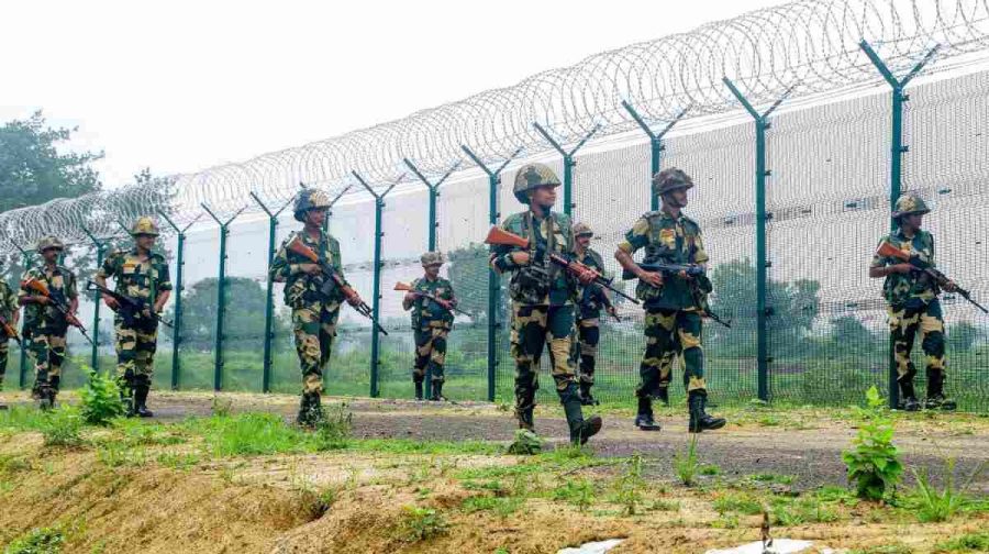 South Dinajpur, Aug 14 (ANI): BSF personnel keep vigil amid high alert at the India-Bangladesh international Border on the eve of the Independence Day, at Chatrahati in South Dinajpur on Wednesday. (ANI Photo)