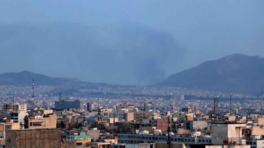A plume of smoke rises following airstrikes in Tehran on March 4, 2026. Iran's Revolutionary Guards said on March 4 they had total control of the Strait of Hormuz, a key waterway for global energy transit, as Israel launched a new wave of strikes on the Iranian capital. (Photo by ATTA KENARE / AFP)