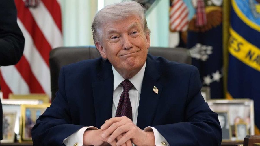 President Donald Trump listens in the Oval Office of the White House before signing an executive order Tuesday, March 31, 2026, in Washington. (AP Photo/Alex Brandon)