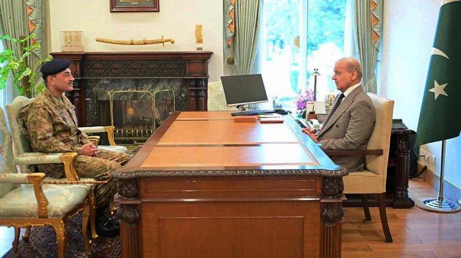 Pakistan's Prime Minister Shehbaz Sharif (R) speaking with Army Chief and Field Marshal Syed Asim Munir at the Prime Minister House in Islamabad. 