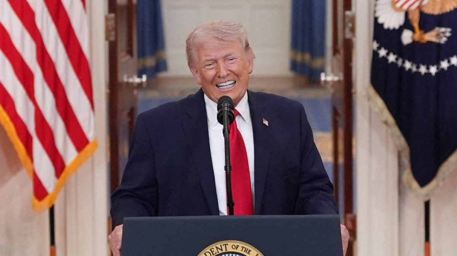 TOPSHOT - US President Donald Trump speaks during a televised address on the conflict in the Middle East from the Cross Hall of the White House in Washington, DC on April 1, 2026. President Donald Trump made his case for attacking Iran in his first nationwide address more than a month into the war, insisting the United States was close to victory as his approval rating sinks. In an evening speech from the White House, Trump broke little new ground on how the war would end and vowed two to three weeks further of "extremely hard" strikes against Iran. (Photo by Alex Brandon / POOL / AFP)