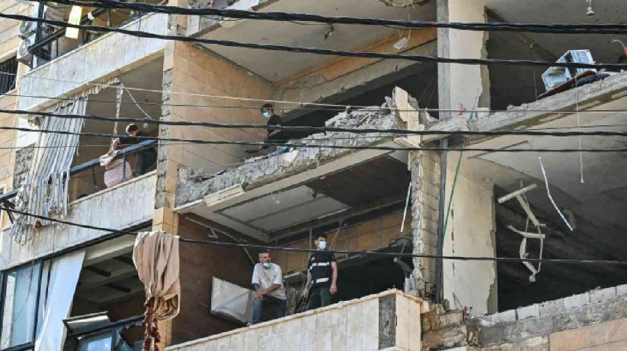First responders inspect damage at the site of an Israeli airstrike targeting apartments in a residential building in Beirut's southern suburbs on June 7, 2026. (Photo by FADEL itani / AFP) /