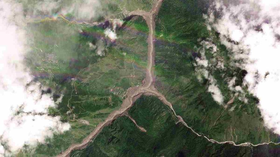 TOPSHOT - This satellite image released by Planet Labs on August 26, 2026 shows an aerial view of the Shyaphrubesi village and Trishuli River after a massive flood in Rasuwa district of Nepal on August 26, 2026. A massive flood and landslide disaster unleashed on the Nepal-Tibet border killed nearly 100 on August 26 and left several hundred people missing, many of whom are foreign tourists. (Photo by 2026 Planet Labs PBC / AFP) / RESTRICTED TO EDITORIAL USE - MANDATORY CREDIT "AFP PHOTO/2026 PLANET LABS PBC  " - NO MARKETING NO ADVERTISING CAMPAIGNS - DISTRIBUTED AS A SERVICE TO CLIENTS