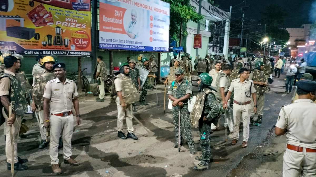 Cuttack: Police and security personnel keep a vigil after fresh incidents of violence linked to a group clash two days ago during a Durga idol immersion procession, in Cuttack, Odisha, Sunday, Oct. 5, 2025. (PTI Photo) (PTI10_05_2025_000398B)