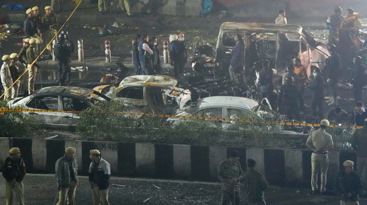 New Delhi: Officers from various security agencies investigate the spot after a blast occurred in a parked car near Red Fort, leaving multiple vehicles in flames, in New Delhi, Monday, Nov. 10, 2025. At least eight people were killed and 24 others suffered injuries in the incident. (PTI Photo/Salman Ali) (PTI11_10_2025_000469B)