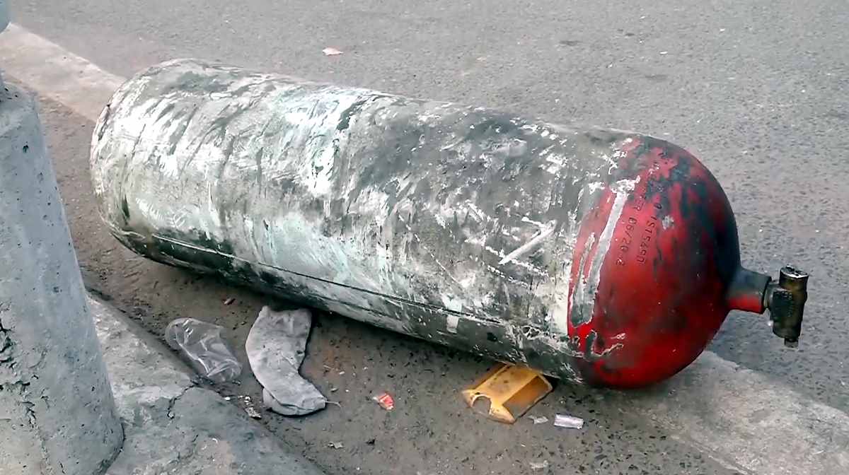 **EDS: SCREENGRAB VIA PTI VIDEOS** New Delhi: Charred remains of a cylinder lie on ground following a blast that occurred near Red Fort Metro Station on Monday, killing at least nine people and gutting several vehicles, in New Delhi, Tuesday, Nov. 11, 2025. (PTI Photo)(PTI11_11_2025_000069B)