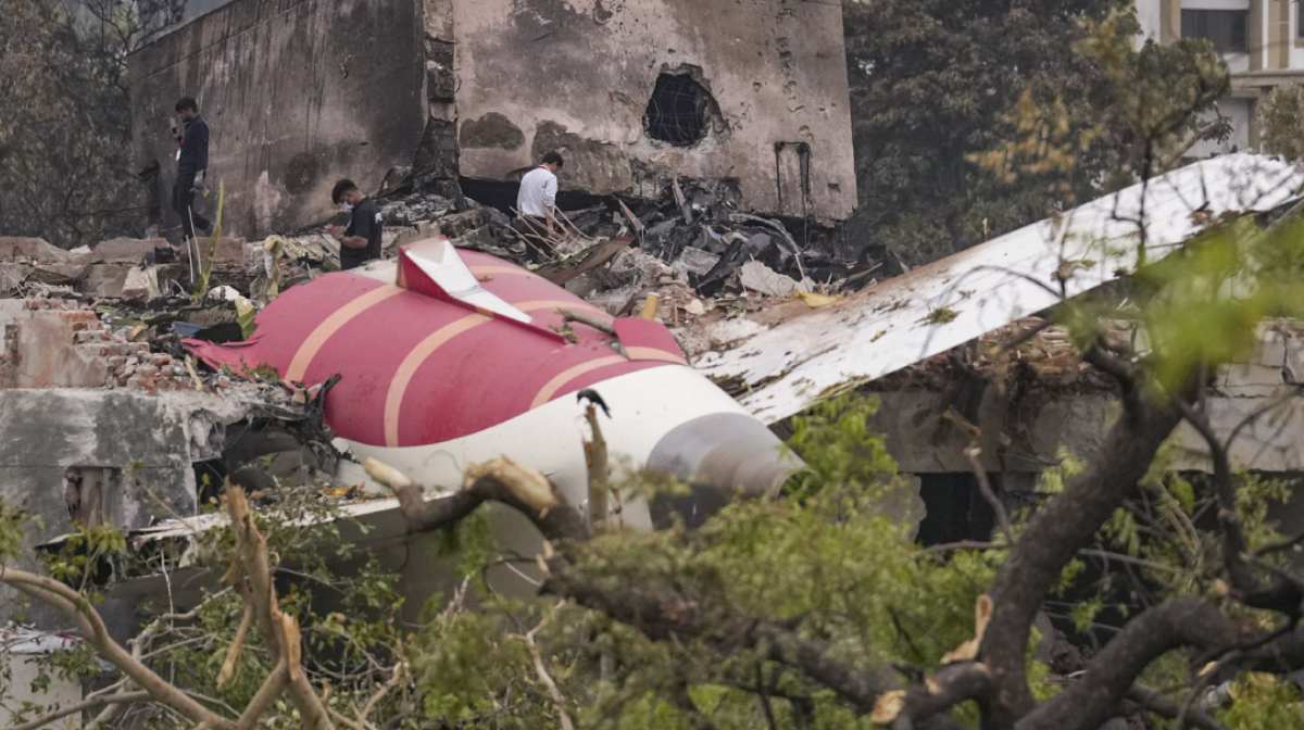 Remains of the crashed Air India plane lie on a building, in Ahmedabad