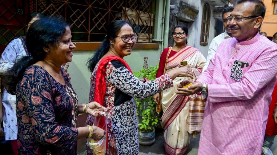 West Bengal Minister and Trinamool Congress (TMC) candidate from Tollygunge constituency Aroop Biswas being greeted by people during his door-to-door campaign for the upcoming state Assembly elections, in Kolkata, Tuesday, March 24, 2026. (PTI Photo) (PTI03_24_2026_000305B)