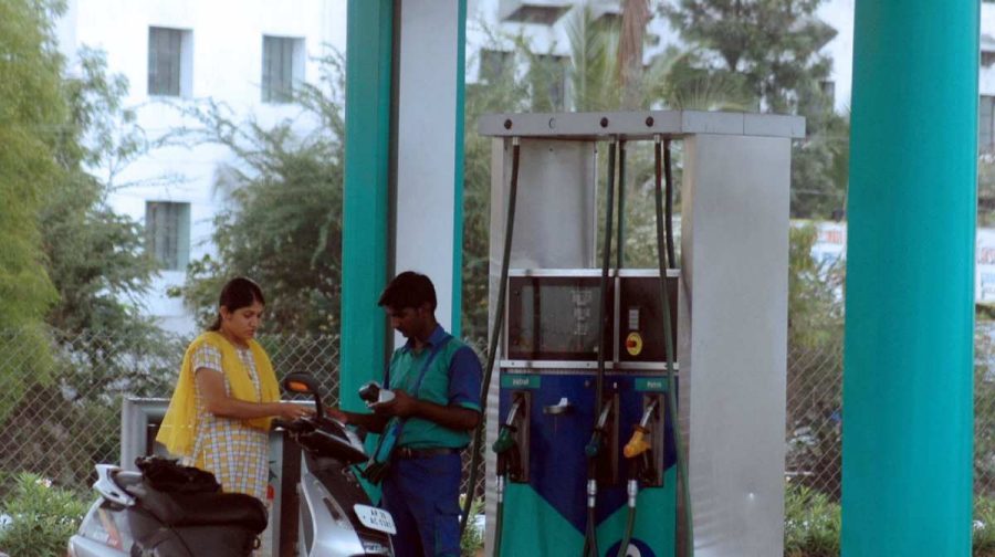 An Indian commuter has her scooter filled with petrol at a Reliance filling station in Hyderabad on March 26, 2008.  Reliance has taken the decision to close two-third of its 1,400 petrol pumps in the country by next month as it is unable to match the fuel price offered by state-run retailers, who get compensated by the Government for selling fuel below the cost. Some 50,000 people are employed in the company's filling stations. AFP PHOTO/NOAH SEELAM