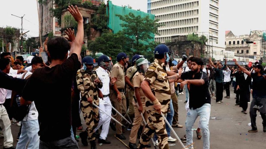 Police officers hold batons as they face protesters during a demonstration in solidarity with protests by the Cockroach Janta Party (CJP) held at Jantar Mantar in New Delhi, demanding the resignation of India's Education Minister Dharmendra Pradhan over exam paper leaks, in Kolkata, India, July 24, 2026. REUTERS/Sahiba Chawdhary