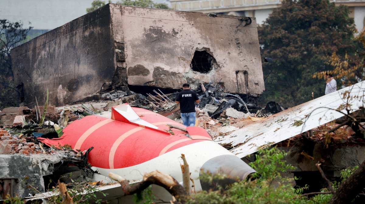 
FILE PHOTO: A firefighter stands next to the crashed Air India Boeing 787-8 Dreamliner aircraft, in Ahmedabad, India, June 13, 2025. REUTERS/Adnan Abidi/File Photo