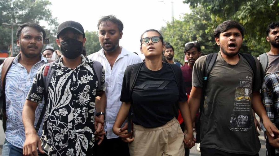 Neha Bora, a prominent student activist, fourth left, walks with others during a youth demonstration demanding the resignation of the country's election chief Gyanesh Kumar, in New Delhi, India, Sunday, Oct. 11, 2026. (AP Photo/Prabhat Mehrota)