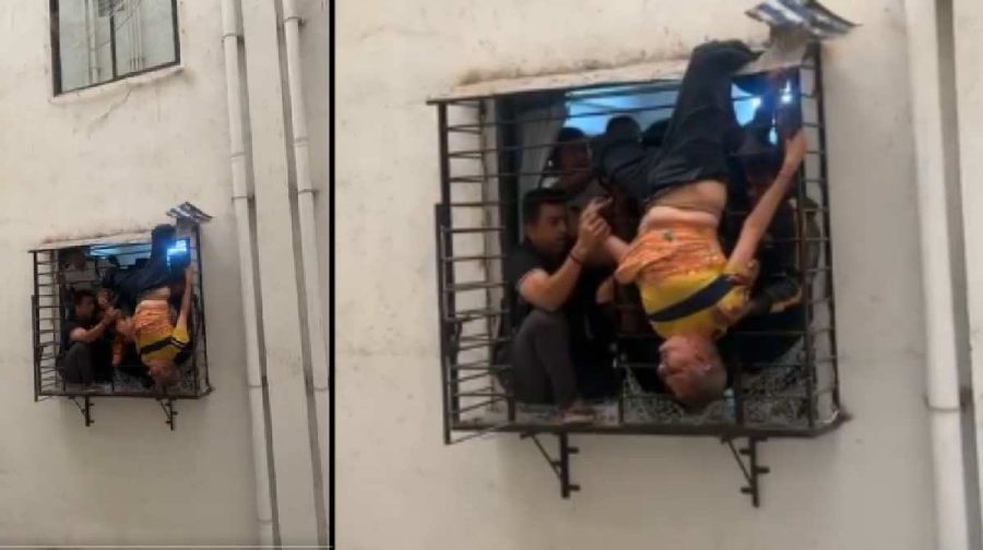 surat-man-stuck-in-window