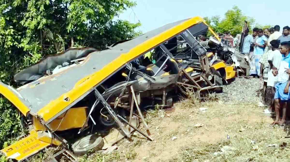 **EDS: SCREENSHOT VIA PTI VIDEOS** Cuddalore: People gather near the wreckage of a vehicle after a school van was allegedly hit by a passing train while attempting to cross a railway track, in Cuddalore, Tamil Nadu, Tuesday, July 8, 2025. (PTI Photo) (PTI07_08_2025_000033B)