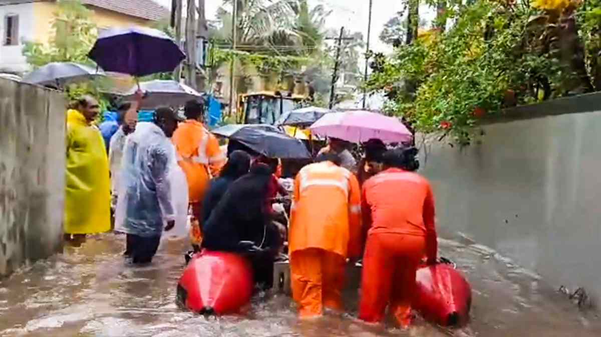 **EDS: SCREENSHOT VIA PTI VIDEOS** Kannur: People being rescued from a flooded area amid monsoon rains, in Kannur, Kerala, Friday, May 30, 2025. (PTI Photo) (PTI05_30_2025_000620B)