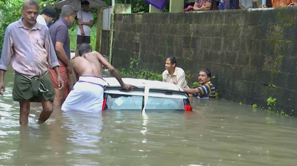 kerala-heavy-rain-ernakulam-car-falls-canal
