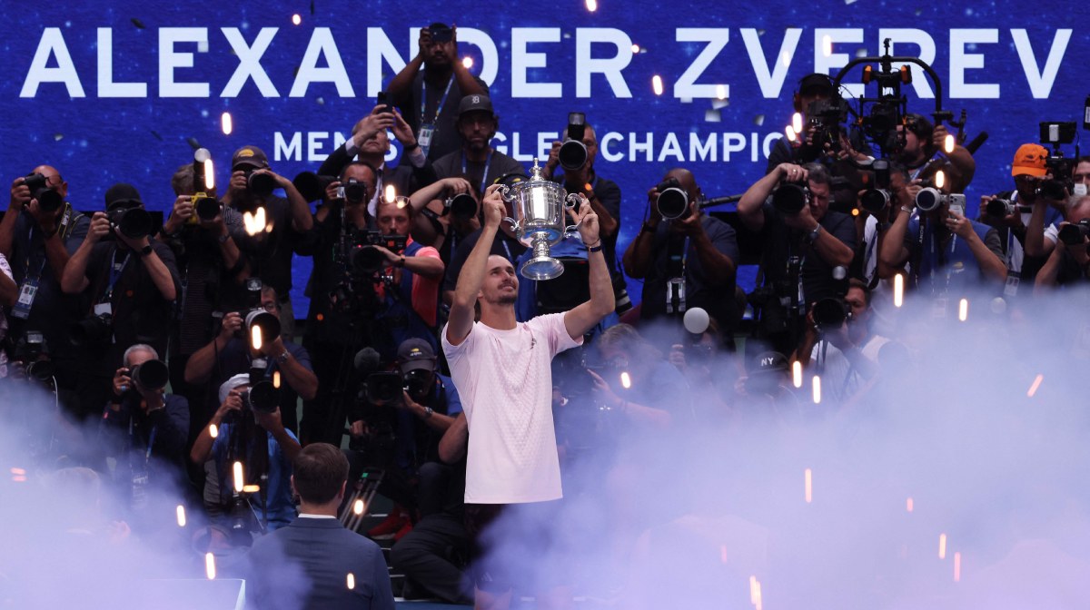 Alexander Zverev of Germany celebrates with the trophy after defeating Ben Shelton of the United States in their Men's Singles Final match on Day Fifteen of the 2026 US Open at USTA Billie Jean King National Tennis Center on September 13, 2026 in the Flushing neighborhood of the Queens borough of New York City. Julian Finney/Getty Images/AFP (Photo by JULIAN FINNEY / GETTY IMAGES NORTH AMERICA / Getty Images via AFP)