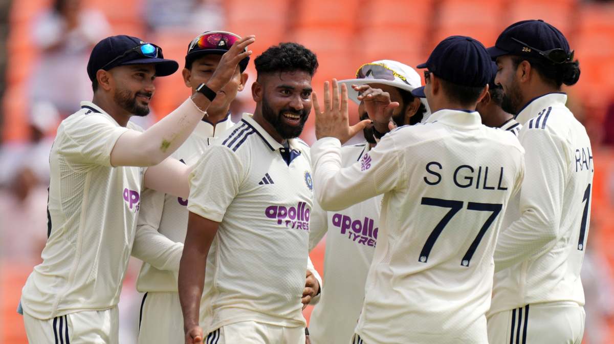 India's Mohammed Siraj, center, celebrates with teammates after the dismissal of West Indies' Brandon King on the first day of the first Test cricket match between India and West Indies at Narendra Modi Stadium in Ahmedabad, India, Thursday, Oct. 2, 2025. (AP Photo/Ajit Solanki)