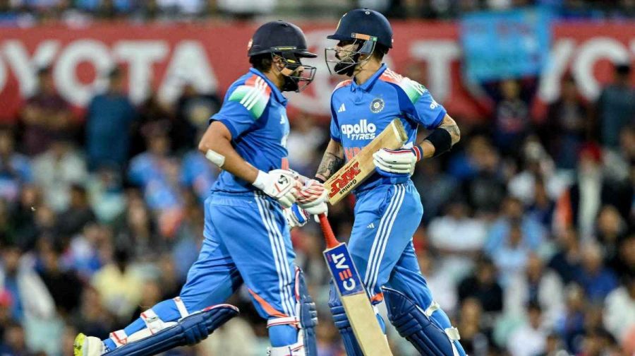 India's Rohit Sharma (L) and Virat Kohli run between the wickets during the third one-day international (ODI) men's cricket match between Australia and India at the Sydney Cricket Ground in Sydney on October 25, 2025. (Photo by Saeed KHAN / AFP) / -- IMAGE RESTRICTED TO EDITORIAL USE - STRICTLY NO COMMERCIAL USE --