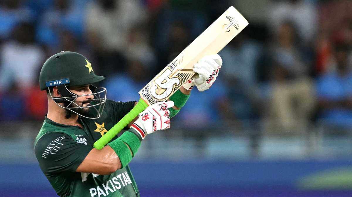 Pakistan's Sahibzada Farhan celebrates after scoring a half-century (50 runs) during the Asia Cup 2025 Super Four Twenty20 international cricket match between India and Pakistan at the Dubai International Stadium in Dubai on September 21, 2025. (Photo by Sajjad HUSSAIN / AFP)